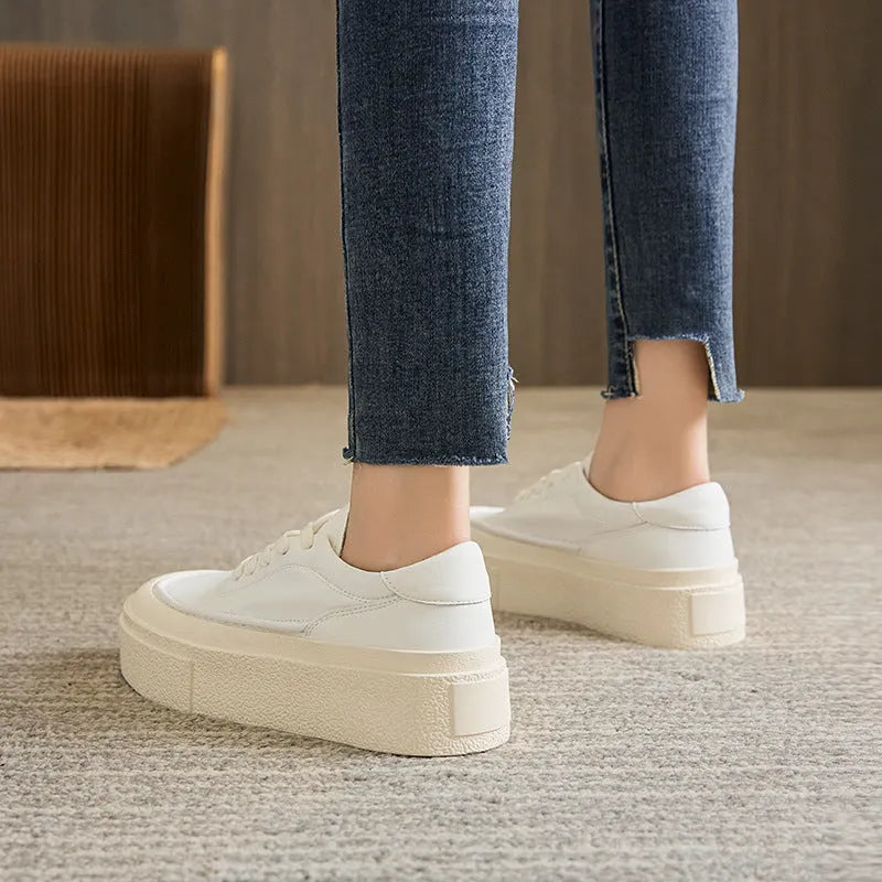 Women's black platform casual shoes with embossed cowhide texture and rubber sole