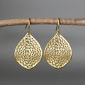 Gold-coloured retro-style drop earrings with a hollow leaf pendant and intricate cut-out detailing.