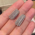 Geometric white gold colour zircon stud earrings with inlaid stone settings on copper