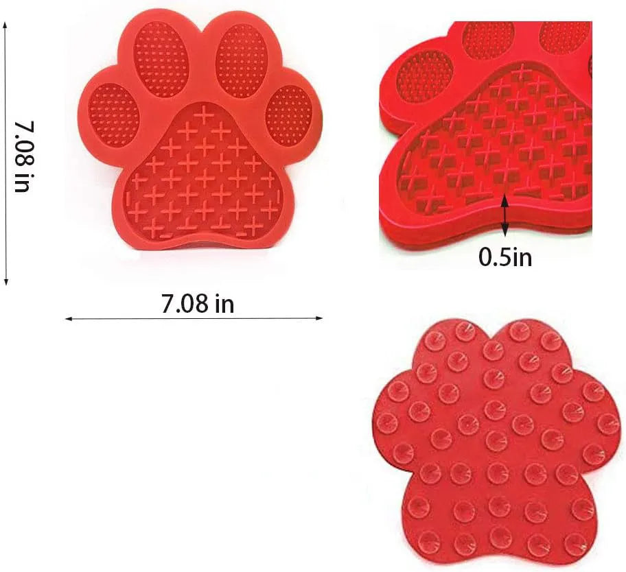 Blue silicone dog licking mat with bone texture and suction cups on a tiled wall