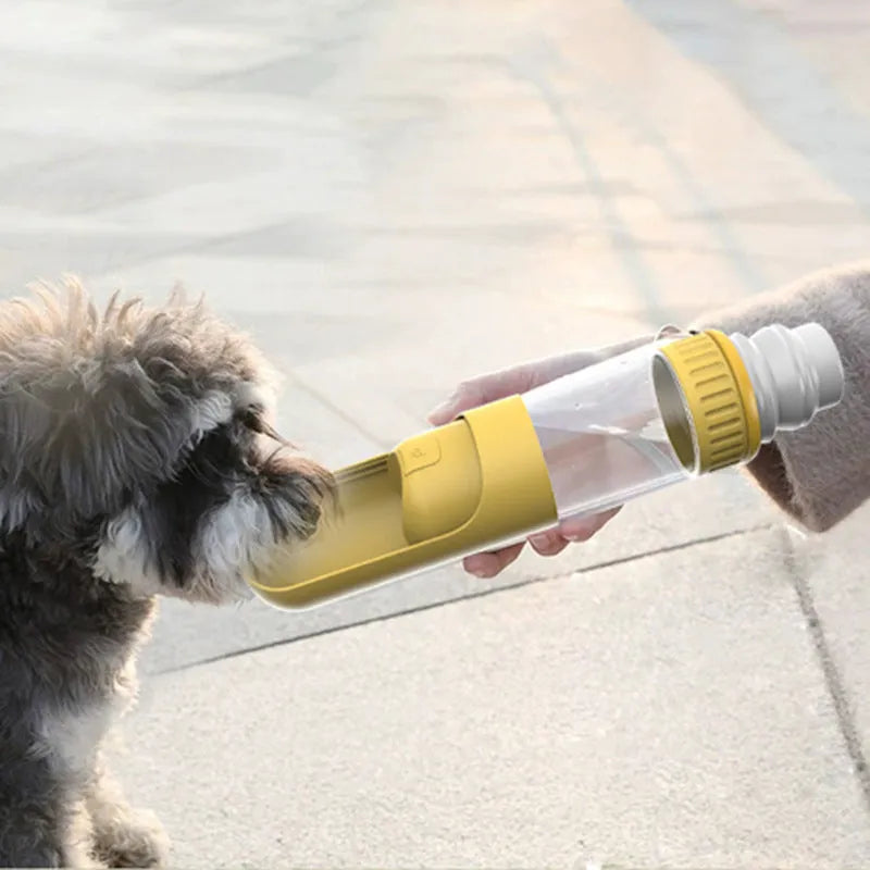 Dark blue portable dog water bottle with built-in bowl, shown with dimensions 215mm by 75mm.