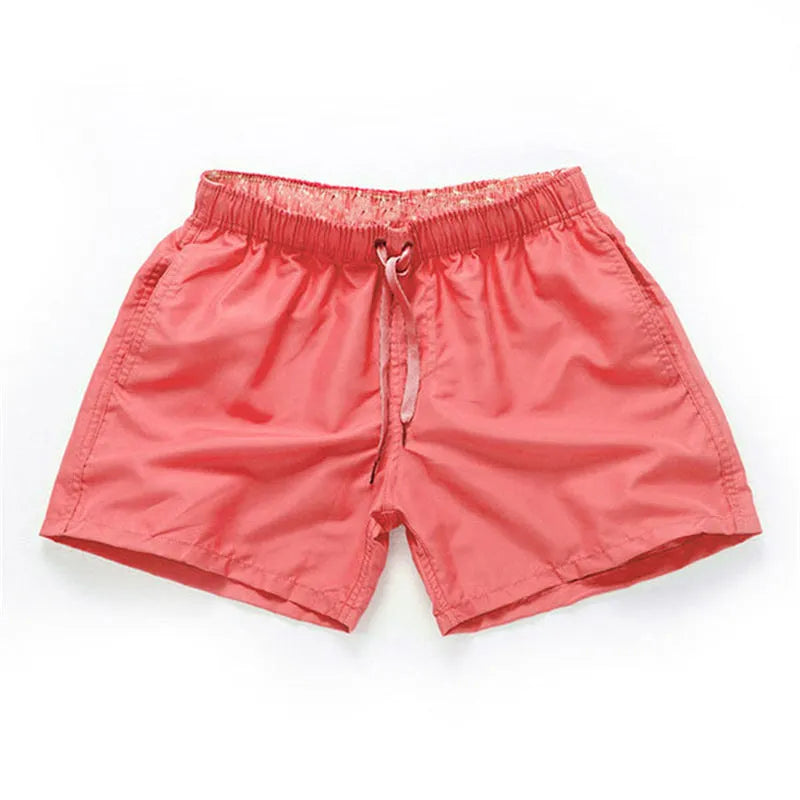 Men's straight leg beach shorts in polyester available in multiple colours and plus sizes.