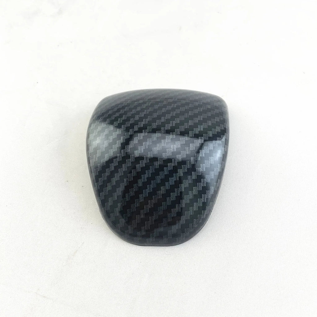 Car gear shift cover in carbon fibre pattern made from ABS plastic