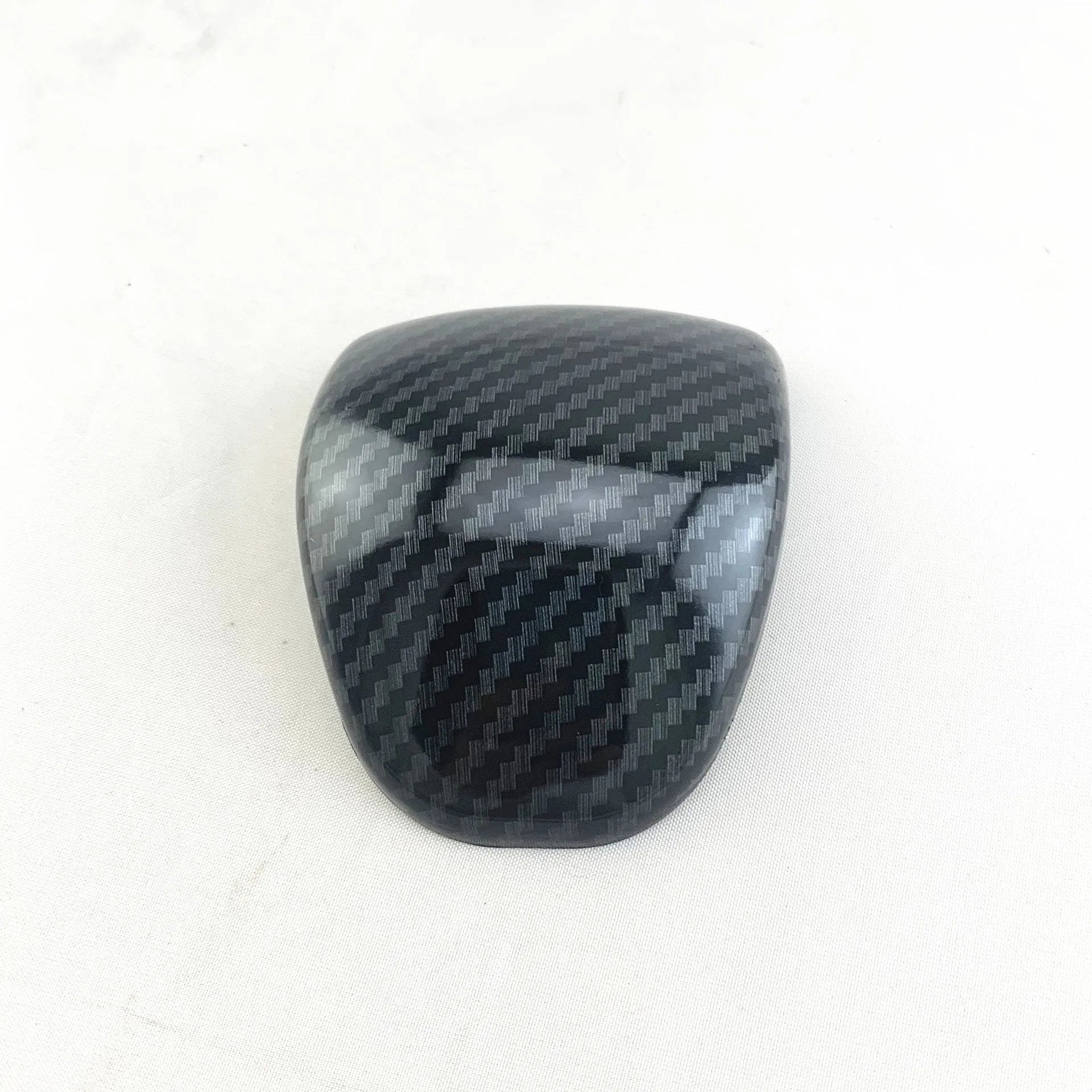 Car gear shift cover in carbon fibre pattern made from ABS plastic