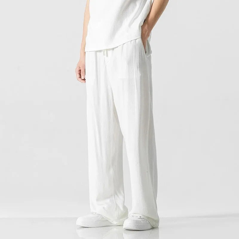 Men's light beige bamboo fibre straight-leg trousers with cropped length and drawstring waist on hanger
