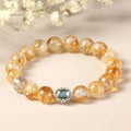 Citrine crystal bracelet with 10mm geometric beads on wrist