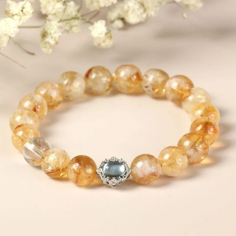 Citrine crystal bracelet with 10mm geometric beads on wrist