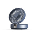 White portable folding fan with remote control and warm night light on a desk.