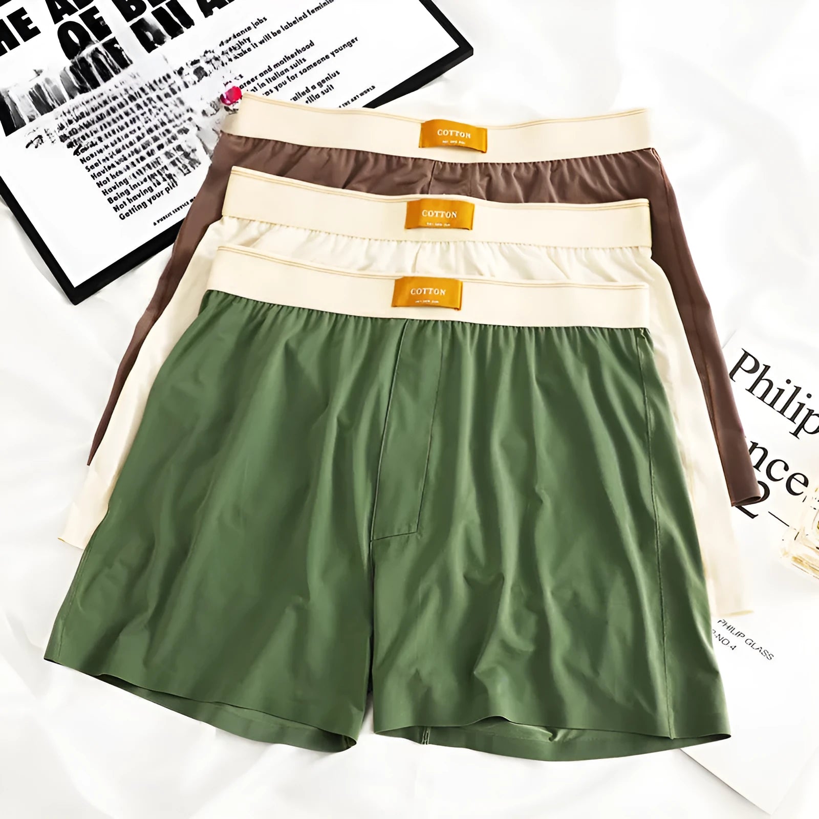 Men's solid colour ice silk loose fit boxer shorts on a white background.
