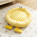 Blue plush kennel sleeping mat for dogs and cats with raised sides in a bear teddy nest design.