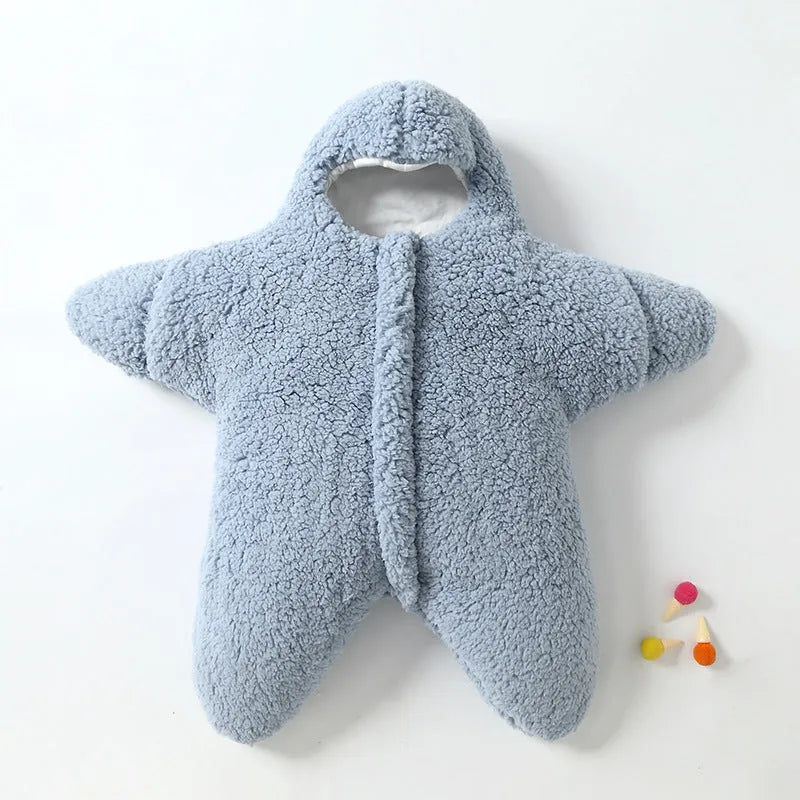 Baby lamb velvet starfish sleeping bag in khaki, hooded with zip and cuffs, lying flat on a surface