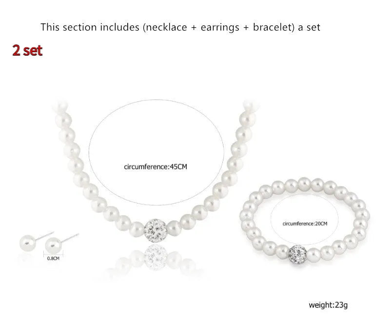 White plastic resin pearl-style jewellery set including necklace, earrings, and bracelet on display