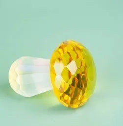 Geometric crystal mushroom decoration in transparent, green, red, or yellow measuring 40mm by 53mm