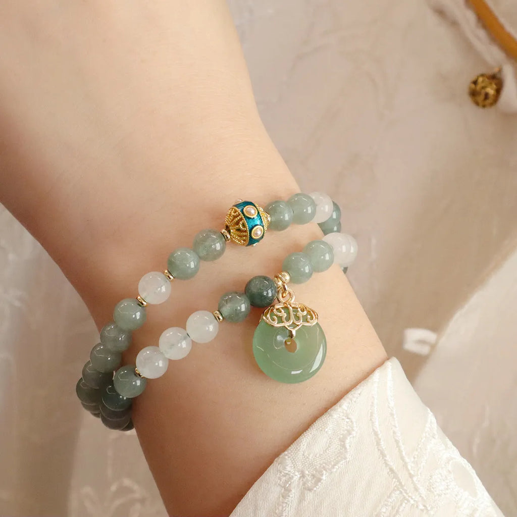 Myanmar jade safety buckle bracelet with geometric peace buckle charm on wrist