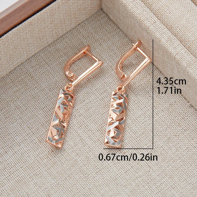 A pair of rectangular two-tone hollow stud earrings with a geometric shape and electroplated finish.