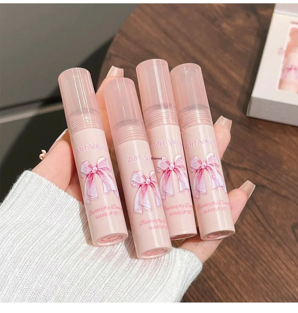 Butterfly Box makeup set with four pink lip mud containers, powder blusher, and necklace