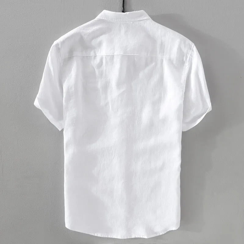 Man wearing a loose fit apricot coloured short sleeve linen cotton blend shirt.