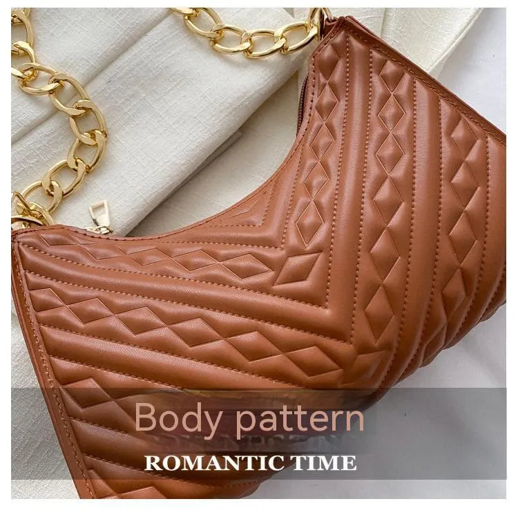 Brown pleated chain baguette shoulder bag showing vertical square shape and adjustable strap