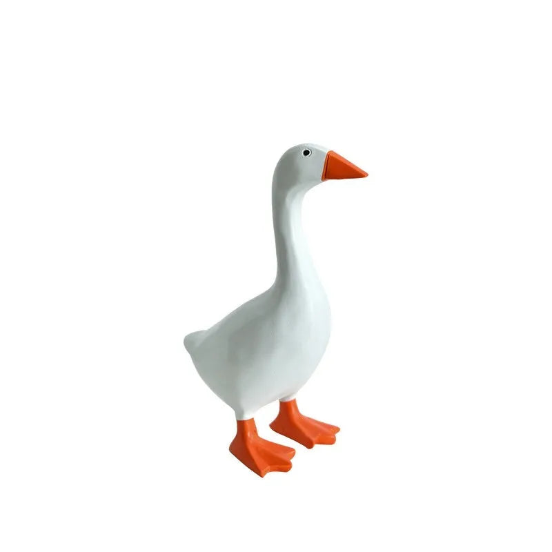 White simulated duck magnetic resin ornament on a fridge door