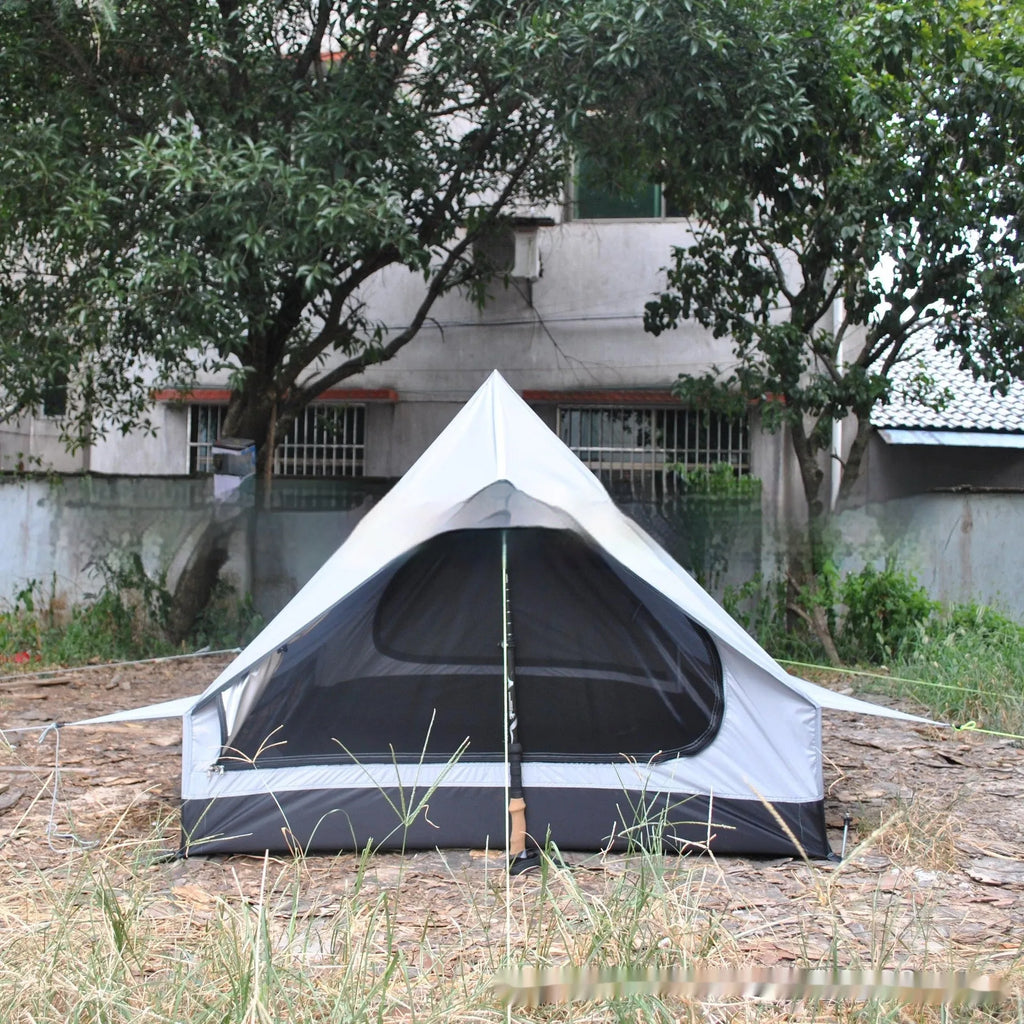 Brown A-line pole-free cabin tent set up with hiking poles showing spacious interior for 2-3 campers