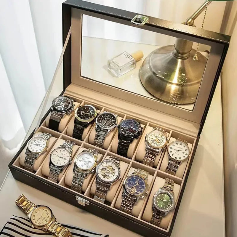 Grey leather watch storage box with see-through lid showing organised watch storage compartments
