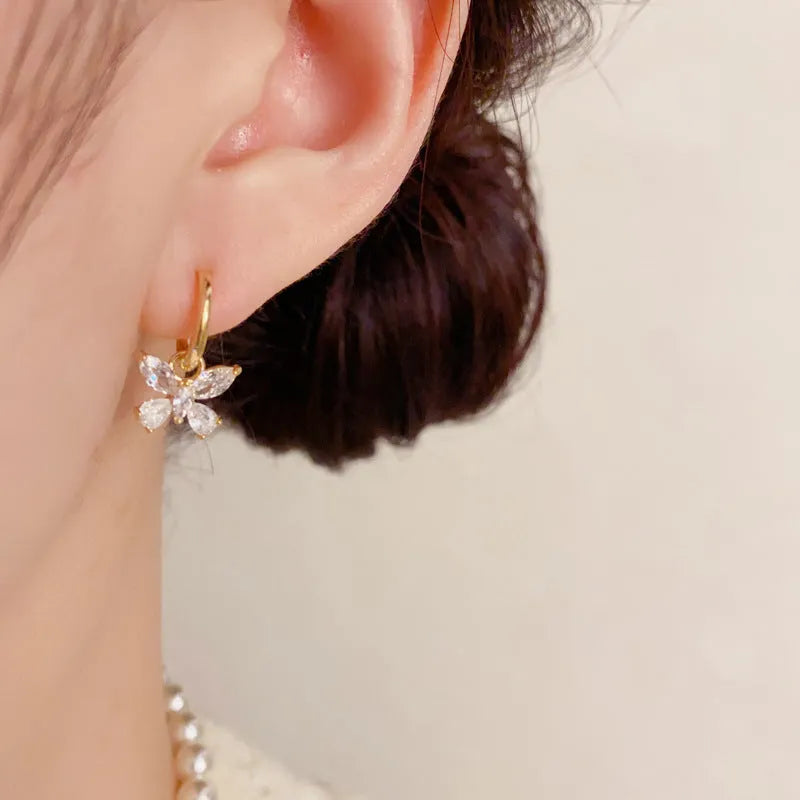 One pair of gold plated copper ear clips with butterfly pearl tassel design, clip-on style for women