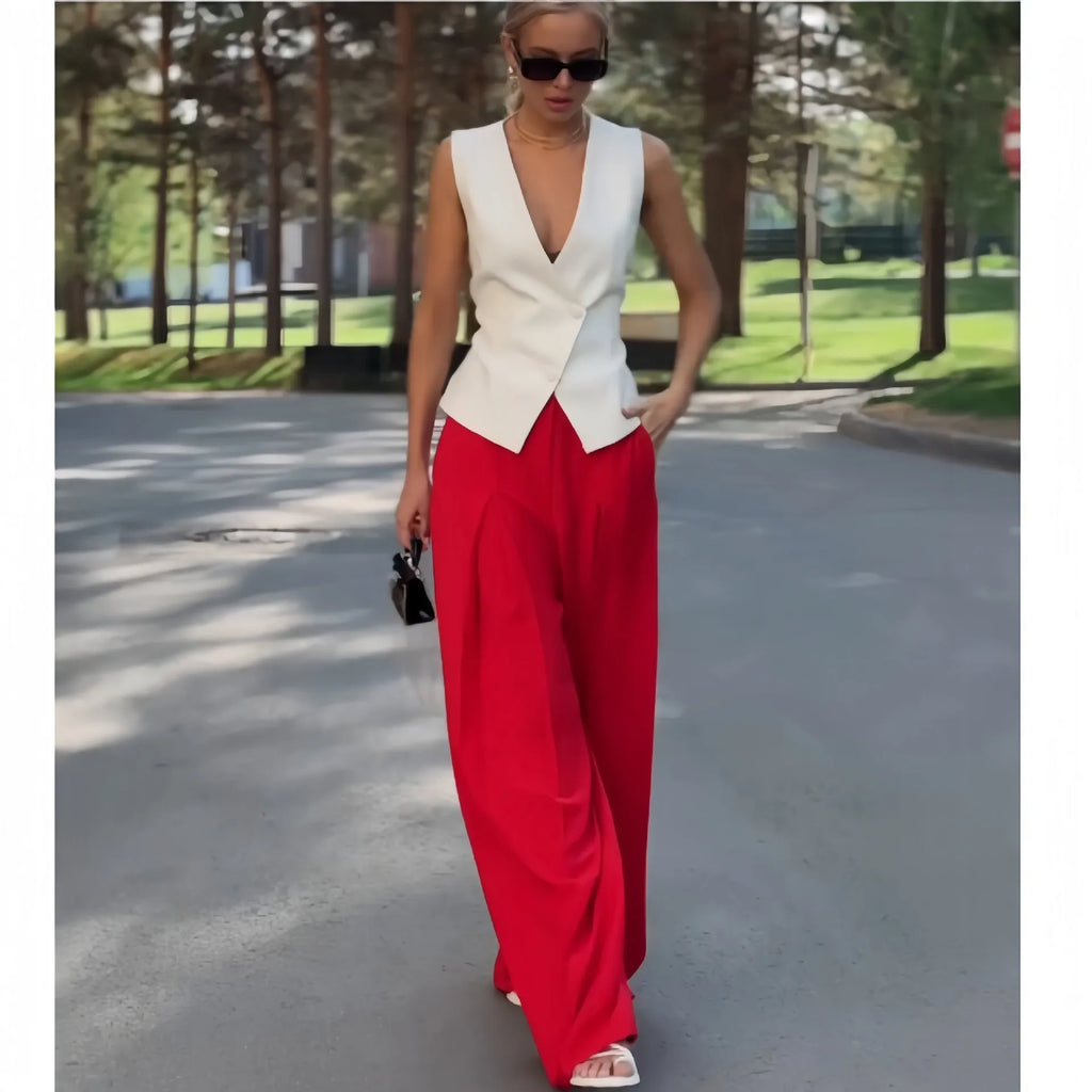 Women's beige two-piece set with deep V-neck sleeveless top and wide-leg trousers
