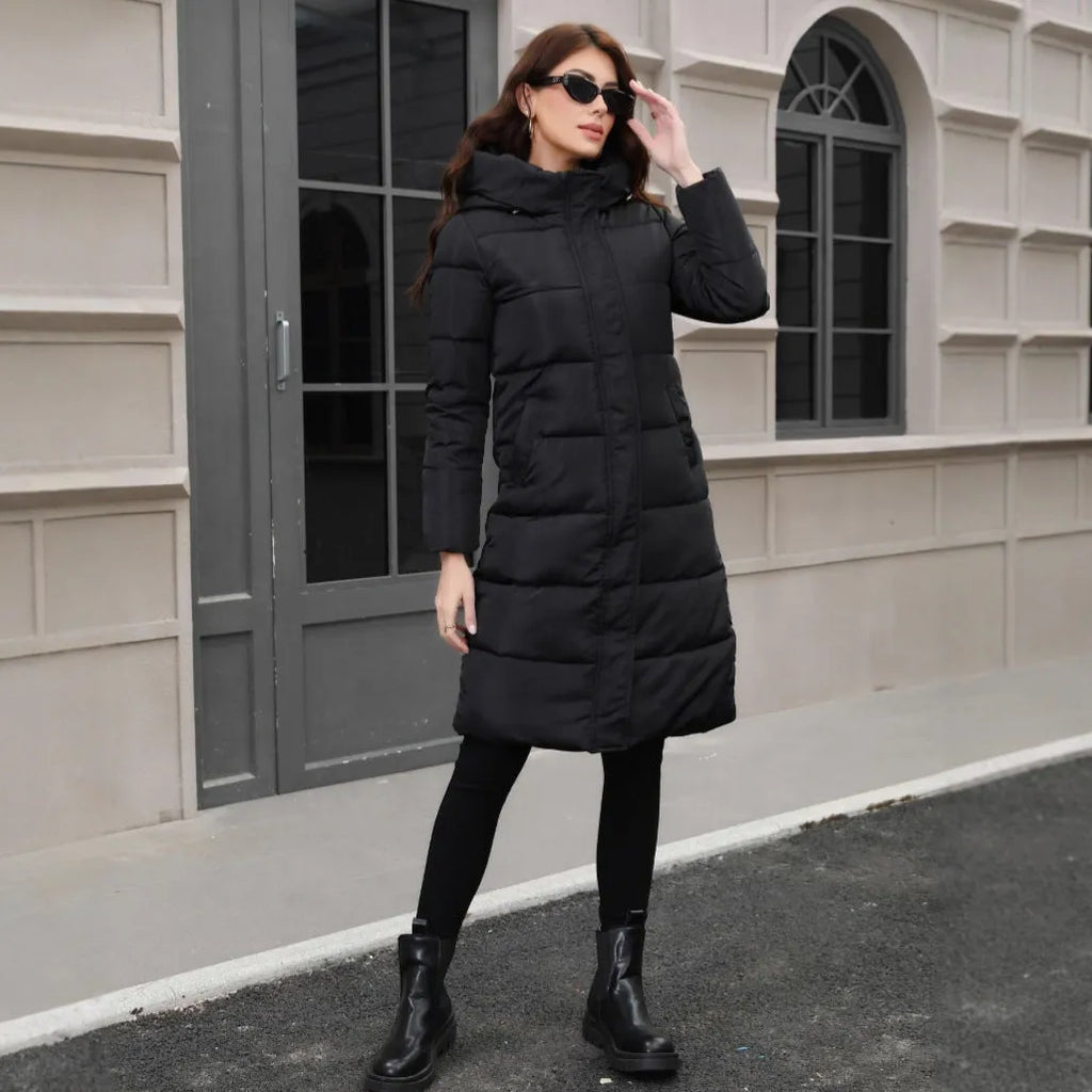 Black slim fit hooded long jacket on a model, showing tapered silhouette and regular sleeves