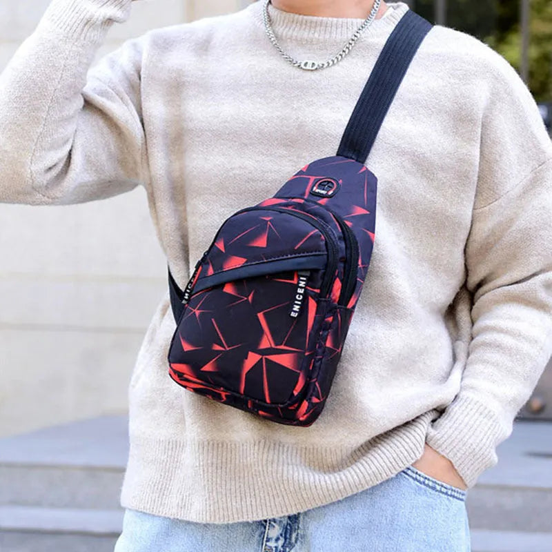 Blue print sling chest crossbody bag for men with an earphone hole and zipper opening.