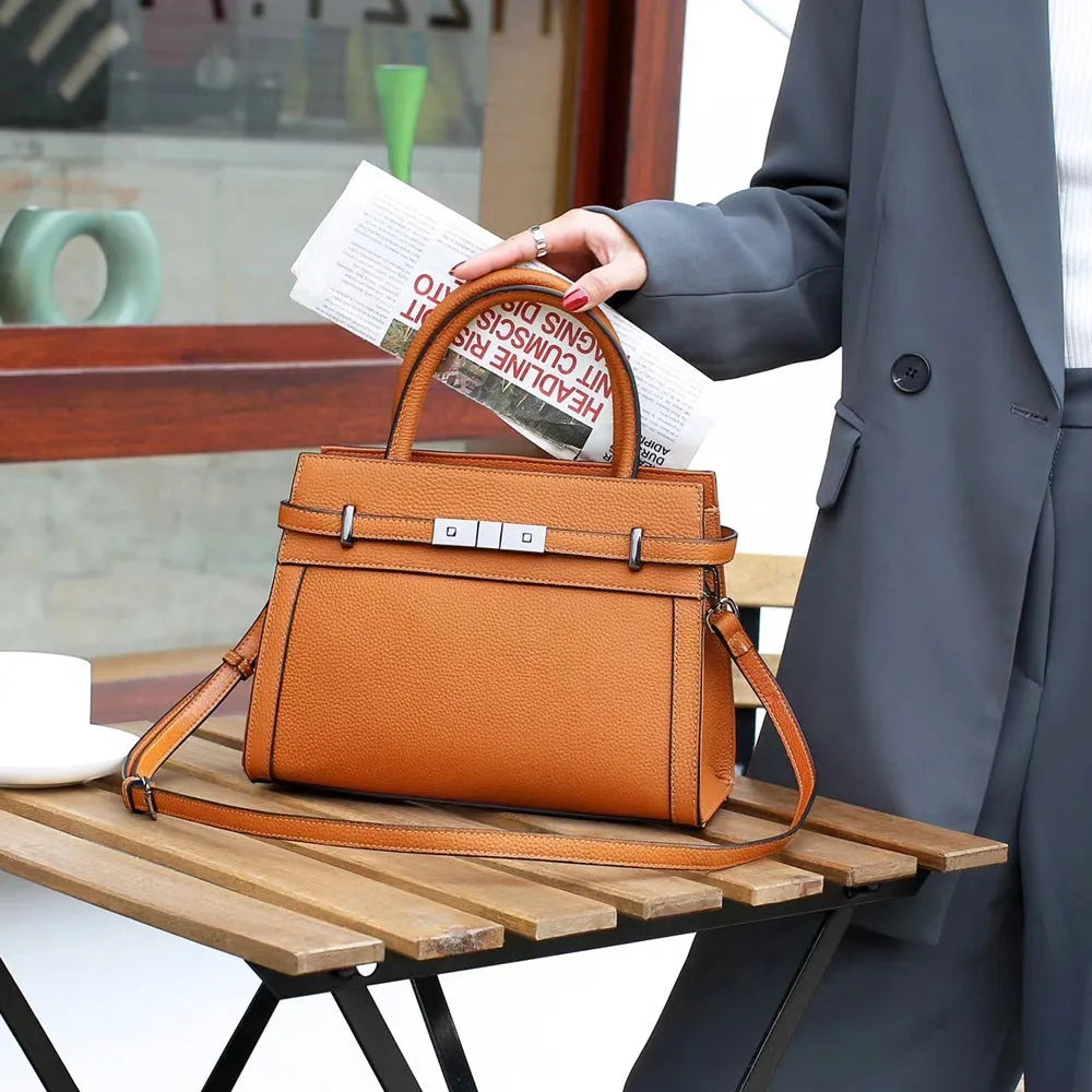 Small square genuine leather shoulder bag in horizontal design with multiple internal compartments