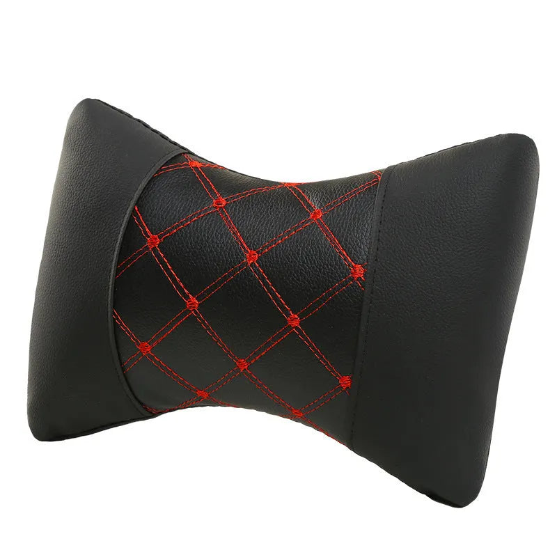 Black leather quilted car headrest pillow with diamond pattern and contrasting stitching