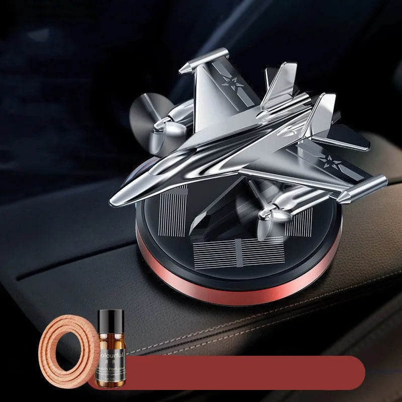 Solar powered rotating fighter aircraft car perfume ornament in silver, gold, blue, or red colours