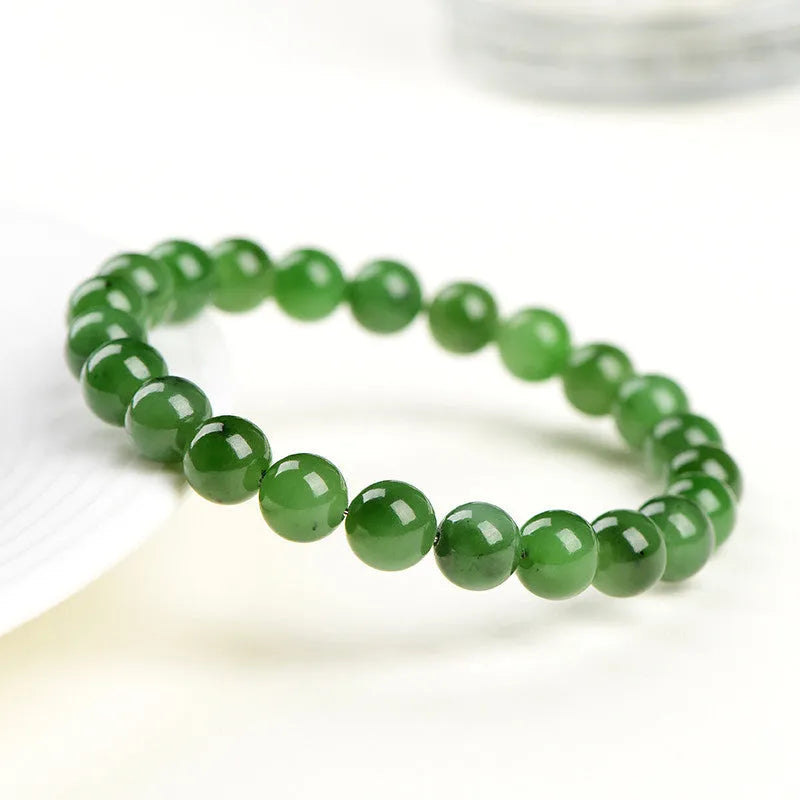 Natural jasper ball bracelet with polished round jade beads on a single strand, showing different bead size options.