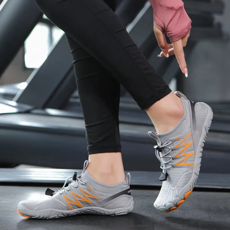 Indoor fitness training sneakers with non-slip rubber sole in various colours showing striped pattern and low top design