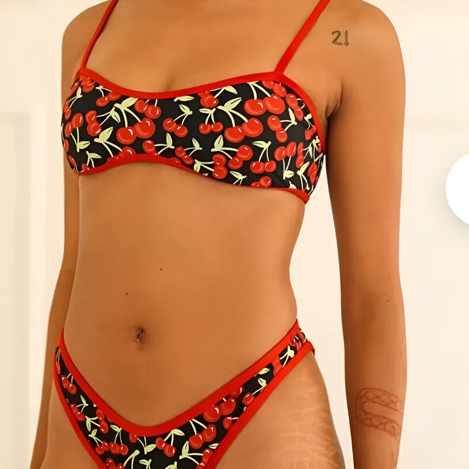 Women's cherry print tube top bikini set with brief bottoms in polyester fabric
