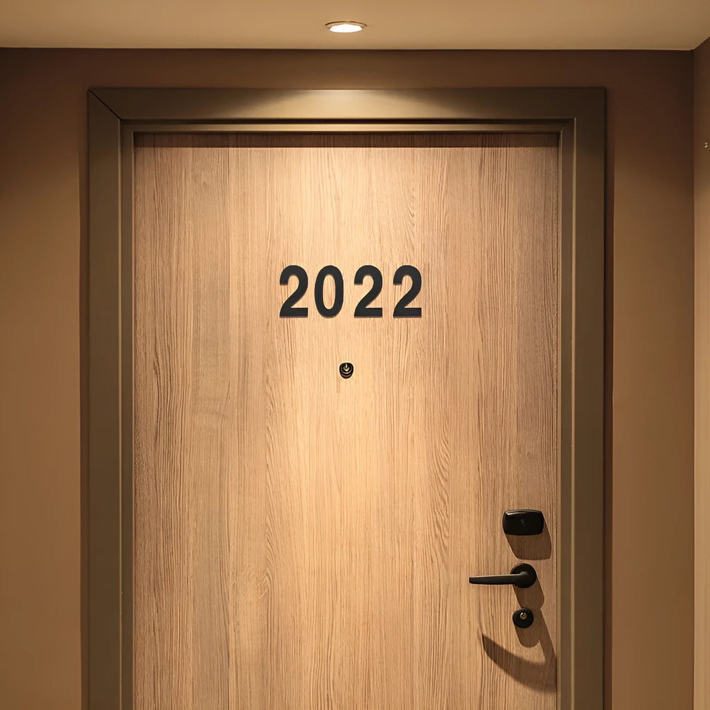 Black stainless steel house number with self-adhesive backing measuring 7.5cm