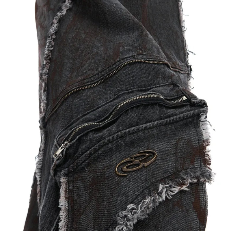 Loose fit black splash-dye distressed denim coat with padded shoulders and matching pants on model