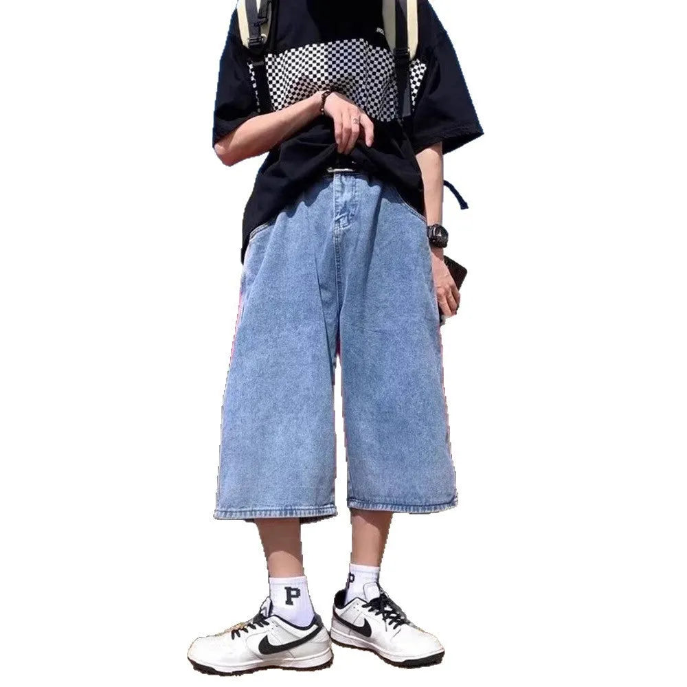 Blue washed denim shorts for men with a high waist, cropped length, and front zip fly.