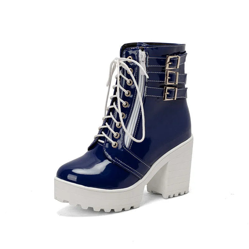 Women's black ankle boot with a thick rubber heel, round toe, and front lace-up closure on a waterproof platform.