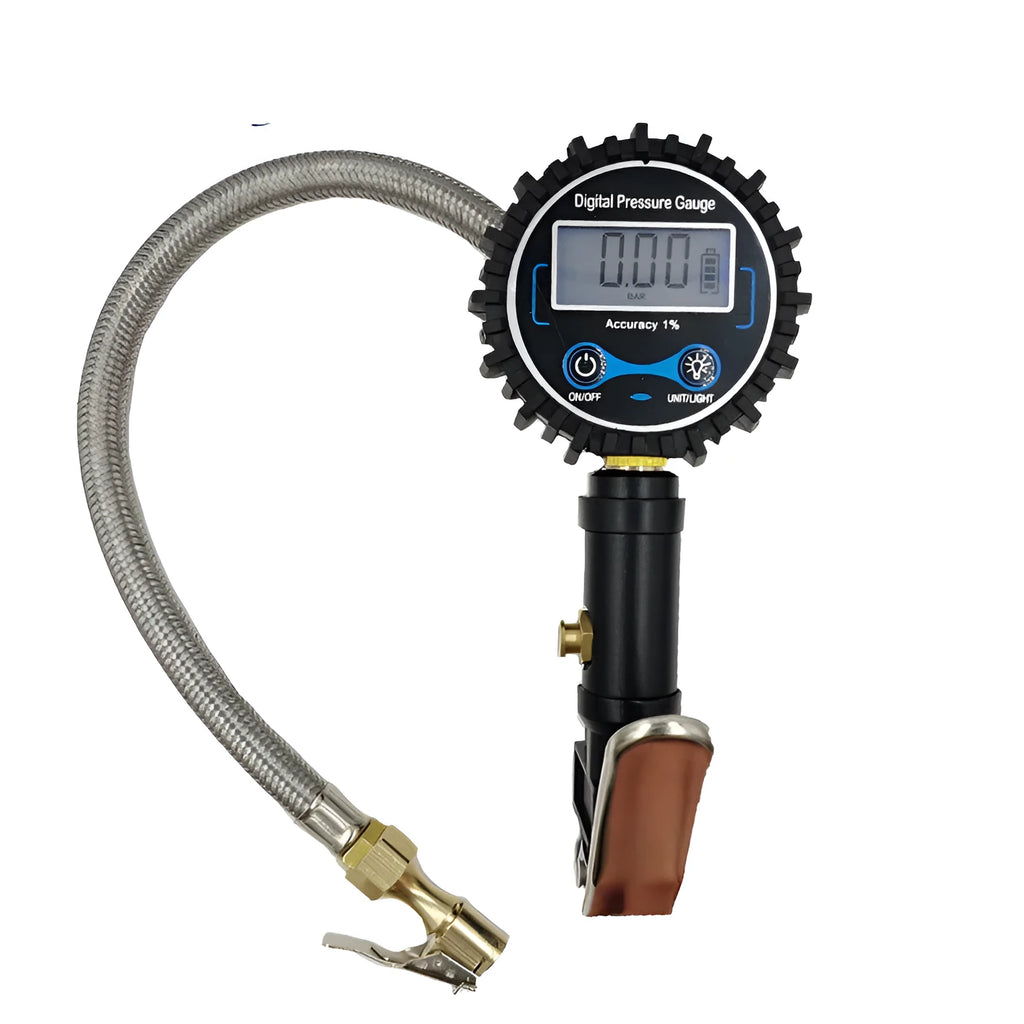 Digital tire pressure gauge with black silver metal body, backlit display, and braided hose on a tyre valve