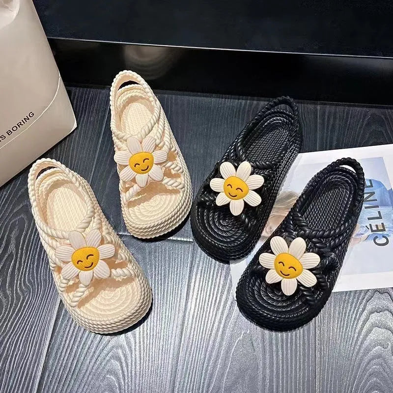 Women's PVC sandals with floral embroidery and non-slip soles in beige or black colours