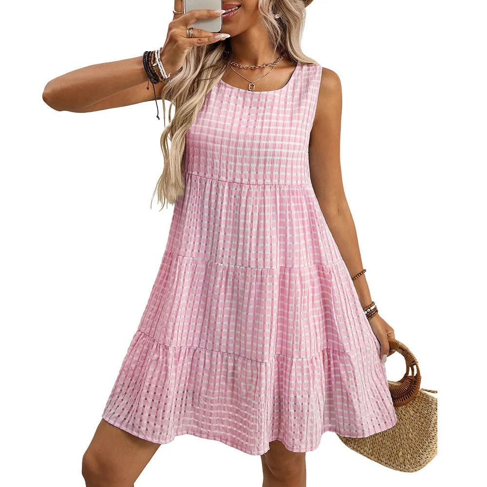 Women's light blue sleeveless plaid dress with high waist and flowing skirt on a model.