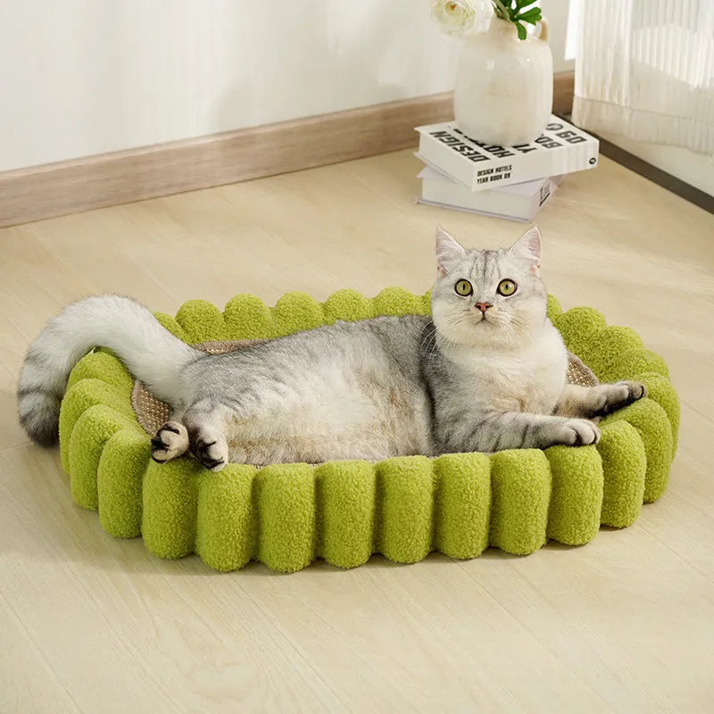 Green oval sisal cat scratch pad bowl serving as a cat bed and furniture protector.