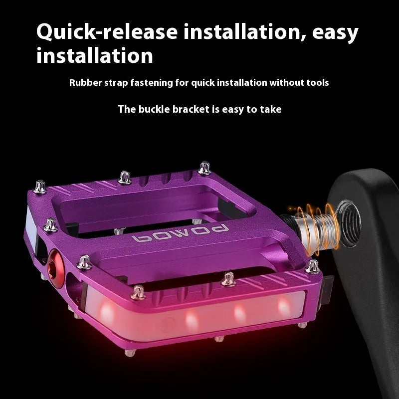 Pair of aluminium alloy bicycle pedals with integrated LED lights in multiple colour options.