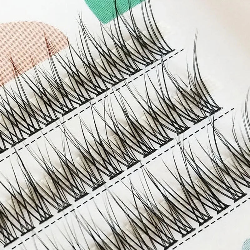 Black V-shaped fairy fishtail false eyelashes in natural long style showing thick segment design.