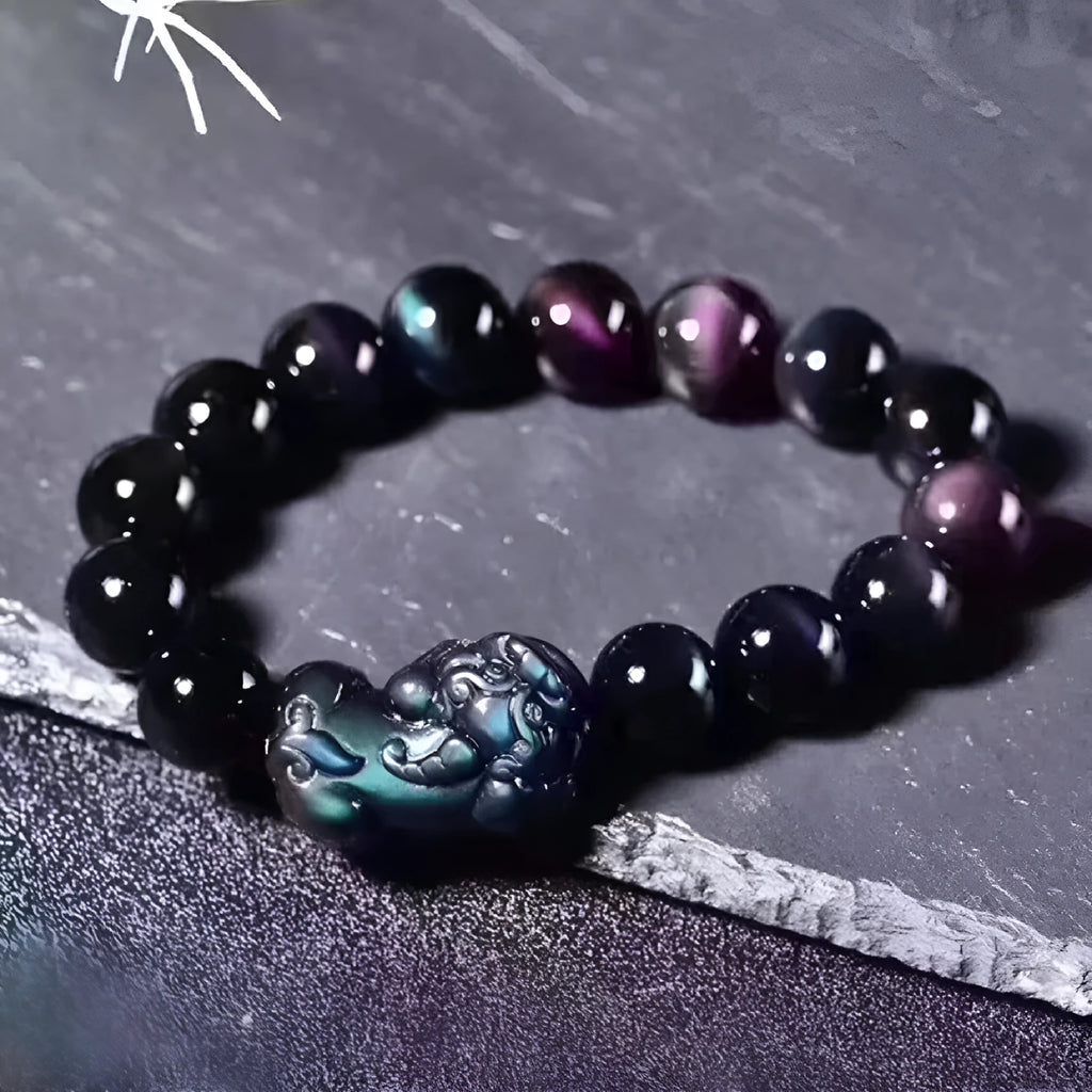 Natural ice colour eye obsidian crystal bead bracelet with spherical beads on wrist.