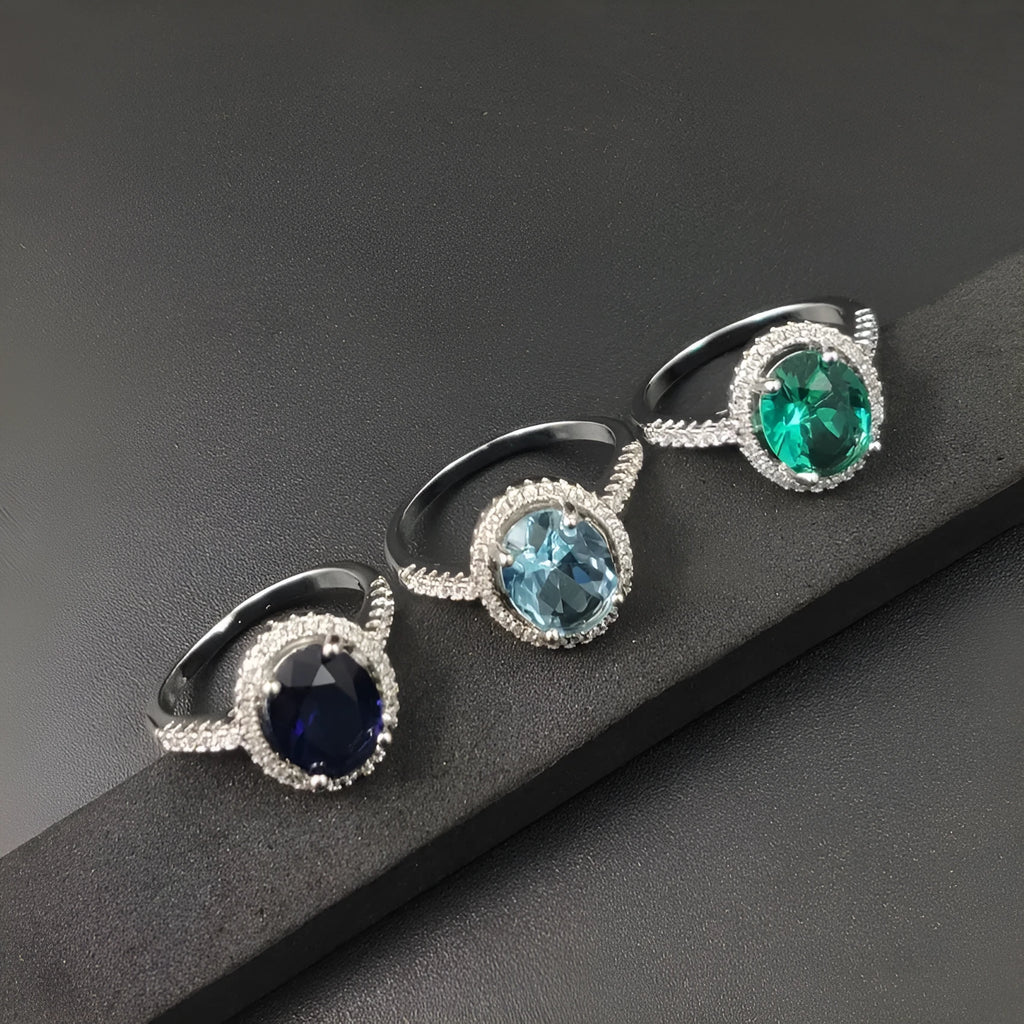 Round zircon ring with electroplated alloy band, available in multiple colours and sizes 6 to 10