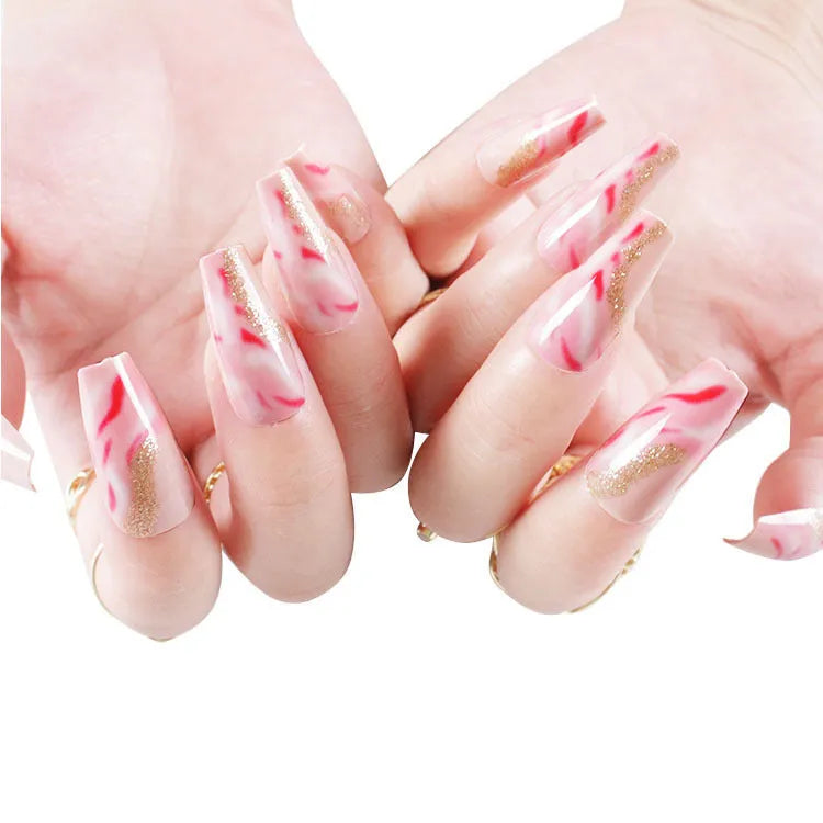 Wearable manicure set with 24 medium false nails in rose, tulip, leopard print, and XINGX patterns, plus glue.
