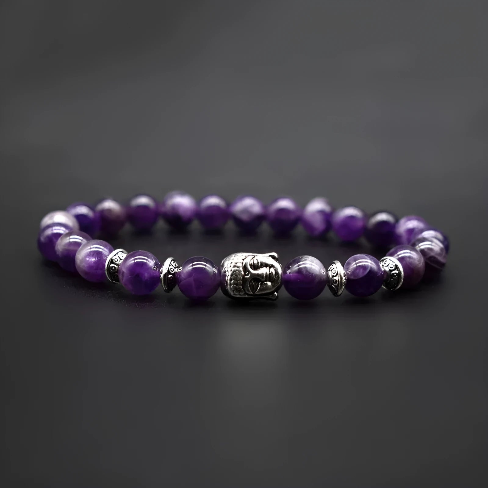 A beaded bracelet with a large 19mm tiger eye stone Buddha head as the centrepiece.