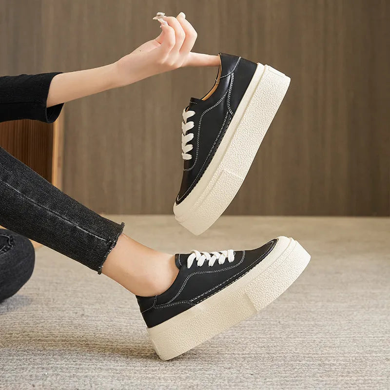 Women's black platform casual shoes with embossed cowhide texture and rubber sole